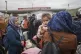 Syrians wait to cross into Syria from Turkey at the Cilvegoz