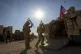 US soldiers enter vehicles at a US military base at an undis