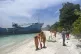 Philippine Coastguards walk beside the MV Lady Mary Joy that