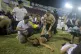 Football fans are assisted by others at the field of the Cus
