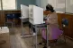 A voter chooses her candidate in a presidential election in 