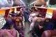 Afghan families board into a bus to depart for their homelan