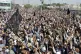 Local residents and Afghan nationals chant slogan during a p