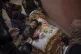 Palestinians mourn their relatives killed in the Israeli bom