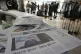 A copy of newspaper with the front page showing a photo of S