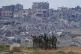 Israeli female soldiers pose for a photo on a position on th