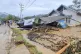 In this image made from video, damaged houses are seen in a 