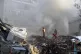 Emergency services work at a destroyed building hit by an ai