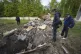 People look at fragments of the television tower which was b