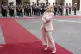 Italy's Premier Giorgia Meloni reacts as an honour guard sta