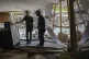 Fema employee Jirau Alvaro works with Daniel Mancini, doing 