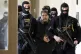 Police escort former PYD co-chair Salih Muslim to court this