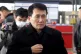 North Korean diplomat Choe Kang Il awaits his plane in Beiji