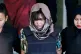Vietnamese Doan Thi Huong (centre) is escorted by police as 