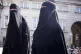 Women in niqab walk, in front of the Danish Parliament at Ch