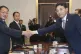 North Korean vice Railroad Minister Kim Yun Hyok, left, shak