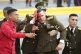 A soldier bleeds from the head following an assassination at
