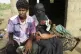 A severely malnourished infant Zahra is changed by her mothe