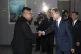 South Korean President Moon Jae In (right) shakes hands with