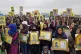 Kurdish protesters hold portraits of loved ones killed fight
