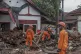 Rescuers search for tsunami victims in Carita, Indonesia, to