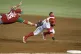 Alexi Amarista of Venezuela's Cardenales de Lara (right) is 