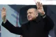 Turkey's President Recep Tayyip Erdogan waves as he addresse