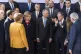 EU leaders stand around listening to European Council Presid