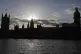The sun sets behind the Houses of Parliament in London today