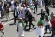 Security forces detain a demonstrator during the weekly prot