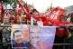 Government supporters cheer during a protest against Michell