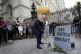 A man in a giant Boris Johnson ‘head’ digs a grave at th