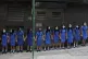 Students wearing mask hold hands to surround St Stephen's Gi