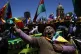 A female supporter of Bolivian President Evo Morales shows h