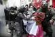 A backer of former president Evo Morales scuffles with polic