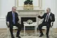 Russia's President Vladimir Putin, right, speaks to Turkish 