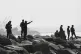 Security forces guard the shore where authorities claim a gr