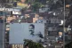 A billboard, backdropped by the Catia neighborhood, promotes