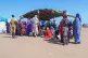 Sudanese refugees gather outside a field hospital in Acre, C