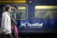 Commuters and travellers at Edinburgh's Waverley Station on 