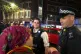 A Kurdish protester is stopped by the police