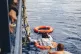 A man who threw himself overboard is brought back onto the N