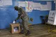 An Air Force soldier votes in a referendum proposed by Presi