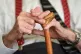 An elderly man holding a walking stick, May 18, 2017