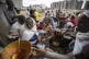 Displaced Tigrayans queue to receive food donated by local r