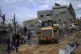 Palestinians search for survivors after an Israeli airstrike