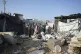 Palestinians gather at the site of an Israeli strike in the 