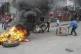 Protesters set up a barricade in the street during a demonst