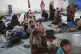 Ethnic Rohingya people take shelter in the basement of a bui