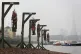 Actors dressed as pirates hang in gibbets at Execution Dock 